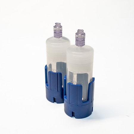 Single-use medical infusion pumps with blue holders, used for safe drug delivery in clinical settings.